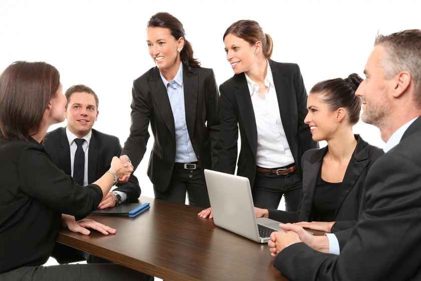 Professional team in concerned meeting discussing project challenges